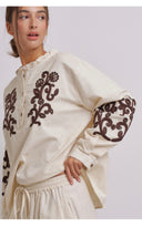 Alma embroidered linen blouse worn by model